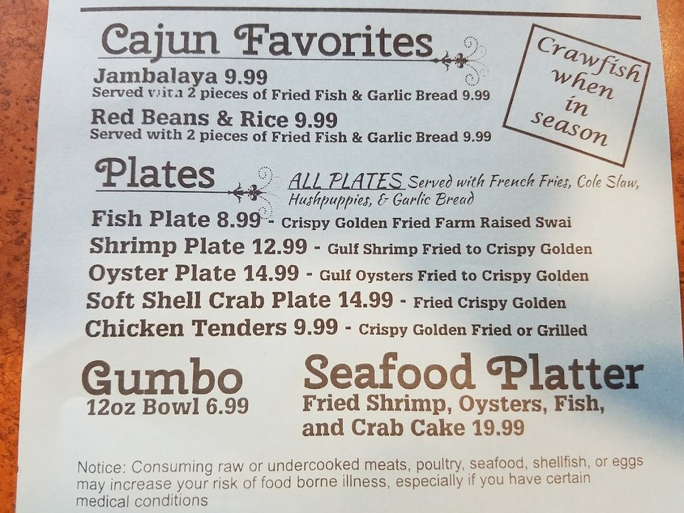 Cajun plates served on a relaxed restaurant table.