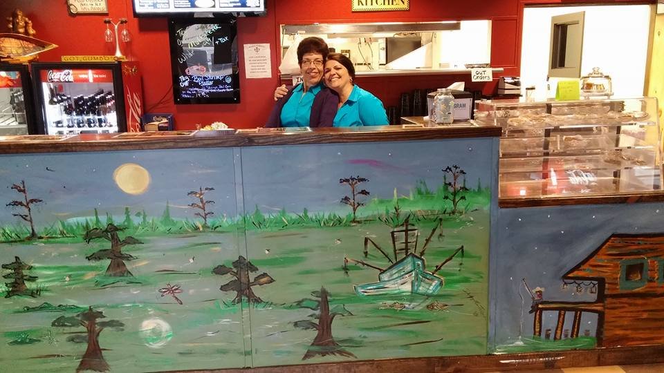 Casual seafood restaurant dining room with simple tables.