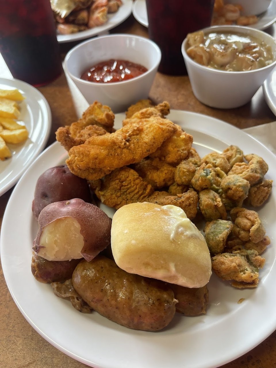 Menu board featuring Cajun favorites and seafood plates.